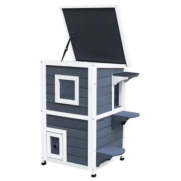 Two-tier grey outdoor wooden cat house with steps and hinged roof