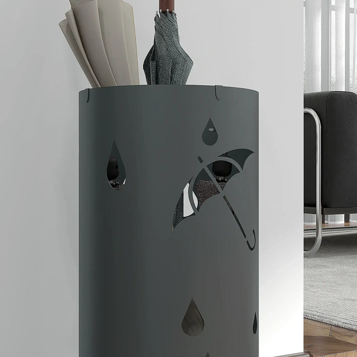Gray umbrella stand with umbrella and books against a white wall