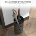 Umbrella stand holding multiple umbrellas with text about galvanized steel frame capacity on a wooden floor.