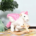 White and pink unicorn rocker plush ride-on toy on patterned rug, indoor setting
