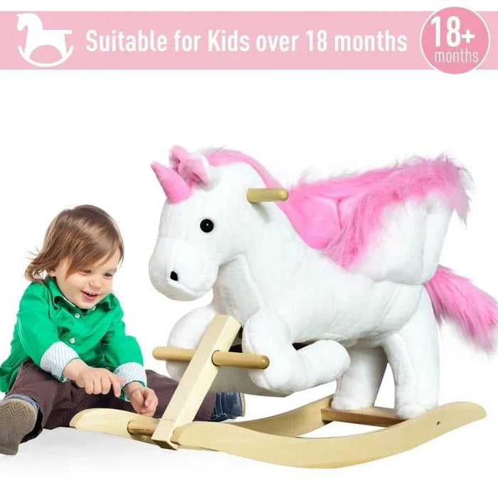 Toddler playing beside white and pink plush unicorn rocker toy for kids over 18 months