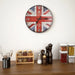 Wall clock with British flag design on a kitchen shelf with spices and containers.