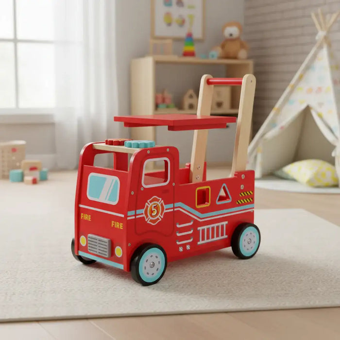 Red toy fire truck with a wooden push handle in a plush bedroom