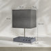 Gray table lamp with dimensions labeled on a neutral background