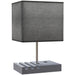 Table lamp with a gray square shade and concrete base on a white background