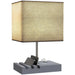 Table lamp with a beige square shade and gray base on a white background