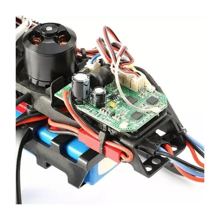 Close-up of V950 single blade RC helicopter 6CH circuit board, wires, and battery.
