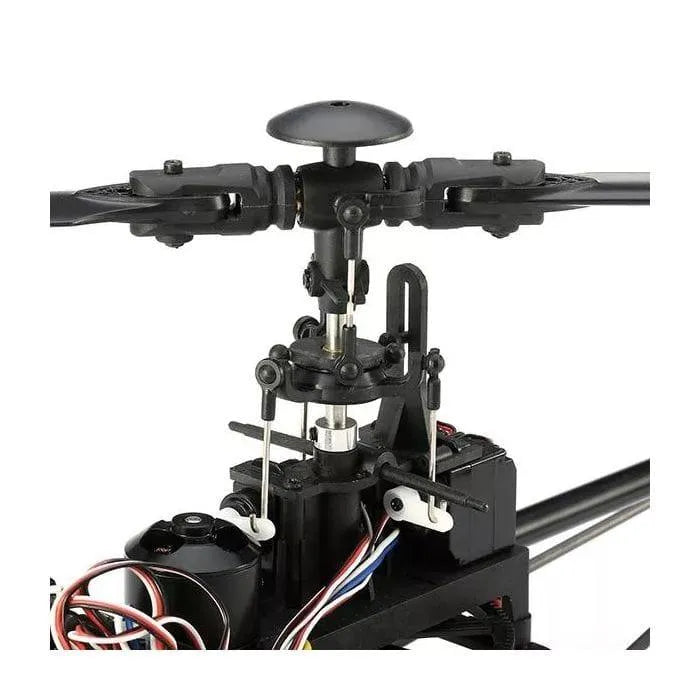 Close-up of V950 RC helicopter rotor head and swashplate assembly with wiring.