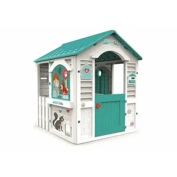 Children's veterinary playhouse with teal roof, animal graphics, and interactive details.