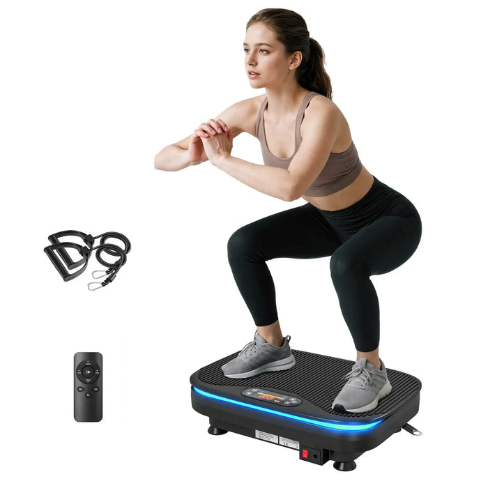 Woman using a vibration plate with resistance bands and remote control on a white background