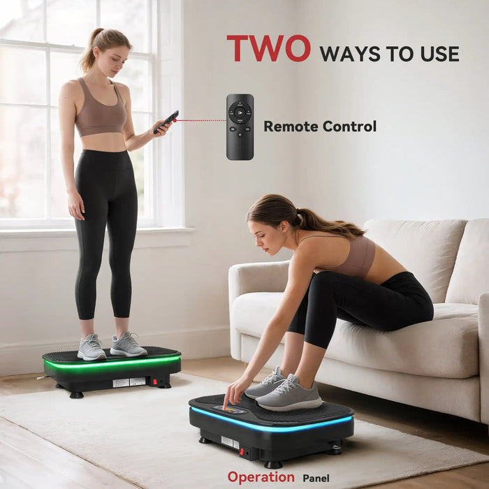 Two women using a vibration plate with remote control and operation panel, in a home setting.