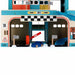 Vintage wooden toy garage with spiral ramp, blue toy car, checkered flags, and race track details