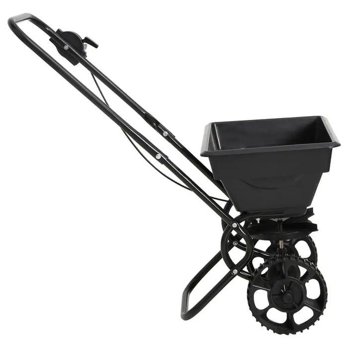 Black walk-behind salt and fertilizer spreader with 15L hopper and two wheels