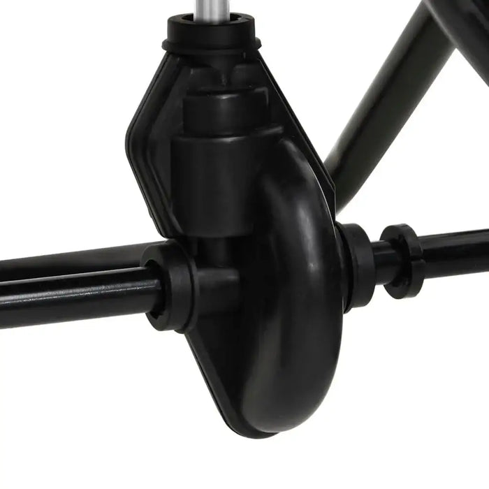 Close-up of black walk-behind salt and fertilizer spreader wheel and frame