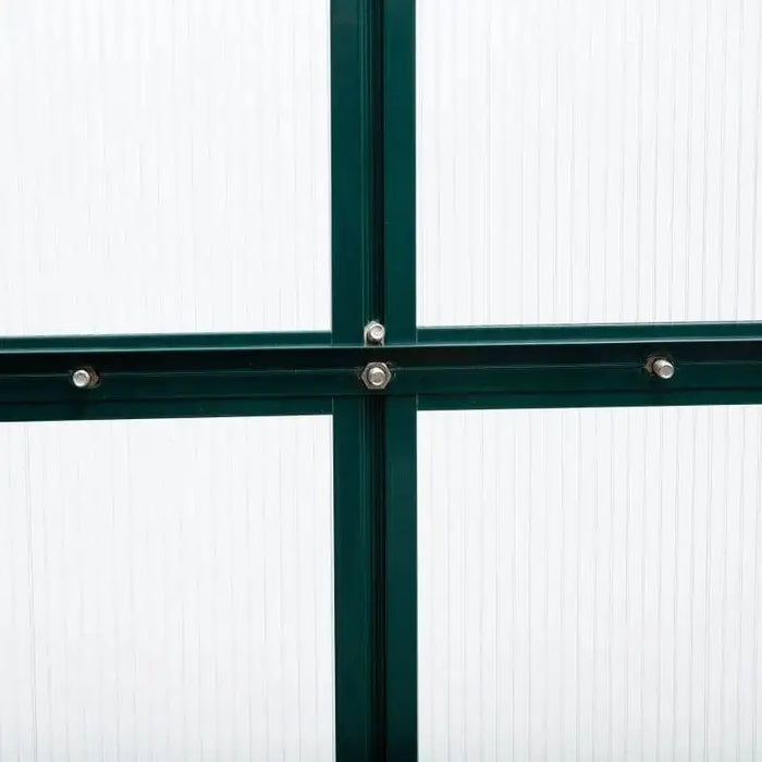 Green aluminium frame cross-section with bolts on polycarbonate greenhouse panel