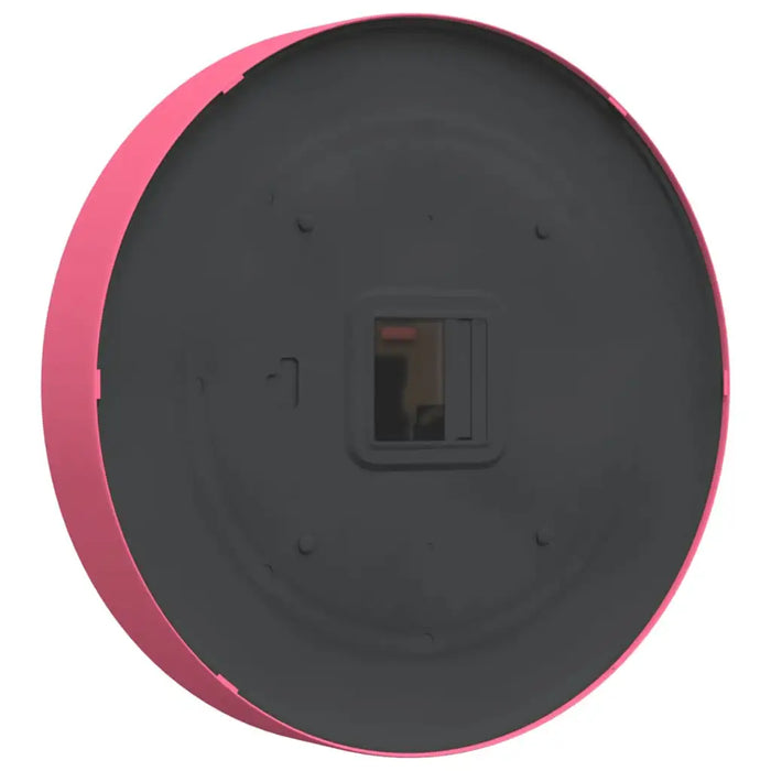 Round black object with pink rim on a white background