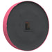Round black object with pink rim on a white background
