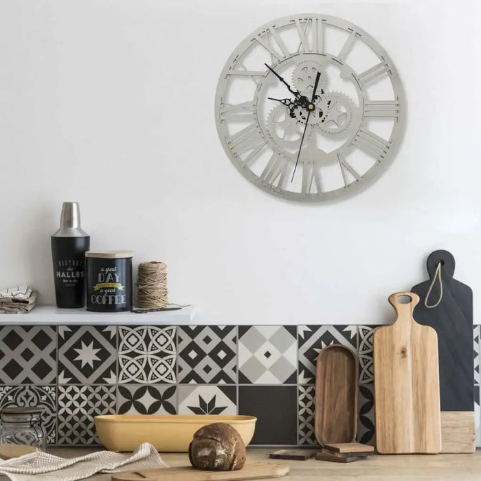 Decorative wall clock with kitchen items and patterned tiles in the background