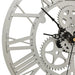Close-up of a clock with mechanical gear design on a white background