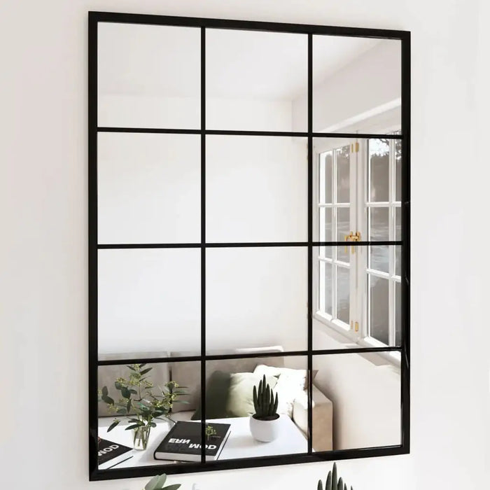 Black-framed mirror with grid design reflecting a living room.