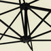 Close-up of black metal ribs and crank hub on sand-colored wall-mounted parasol canopy.