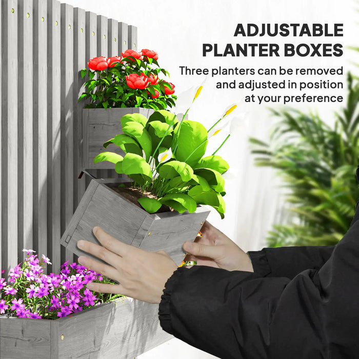 Wall-mounted grey wooden planter with trellis showing adjustable removable planter boxes with green and red flowers