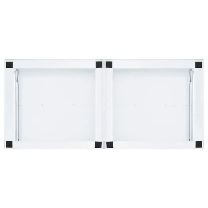 White cabinet with black handles on a white background