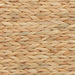 Close-up of natural woven straw texture in warm beige tones for home decor or crafting