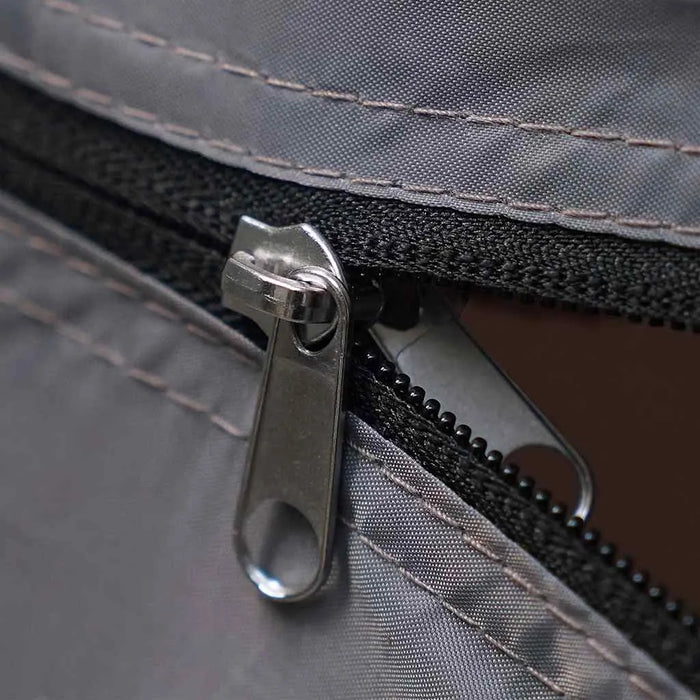 Close-up of waterproof tent zipper on grey camping storage organizer.