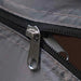 Close-up of waterproof tent zipper on grey camping storage organizer.