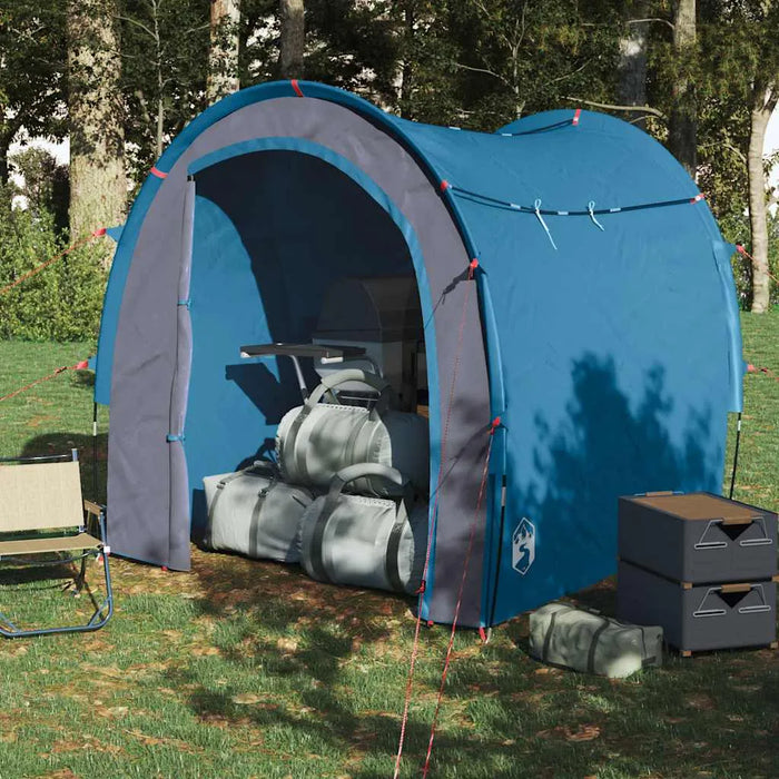 Blue waterproof storage tent for camping with gear bags and organizer boxes outdoors