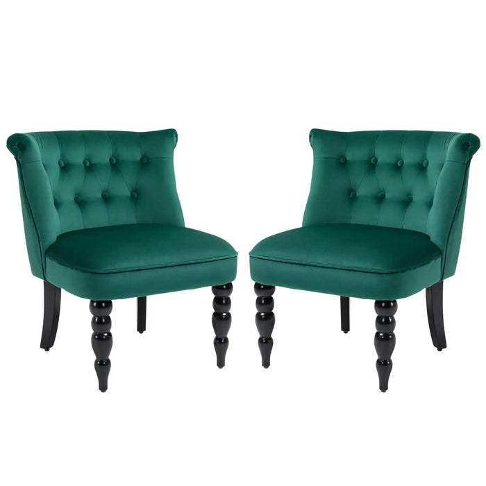 Two green velvet chairs with black legs on a white background