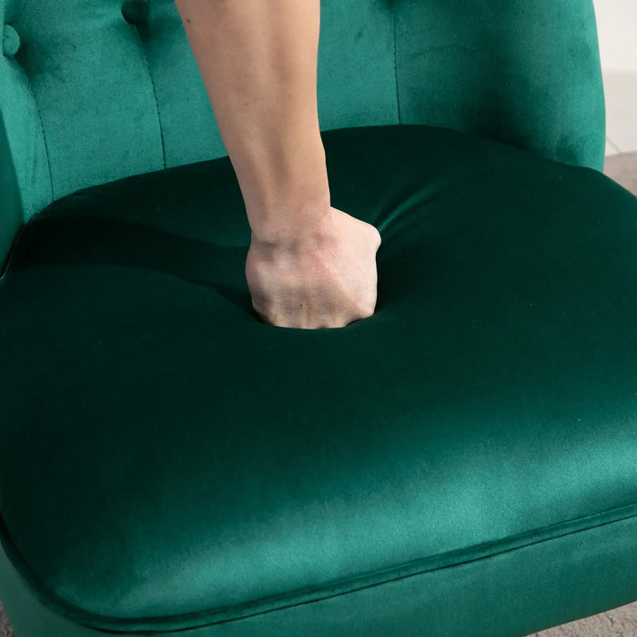 Person's hand pushing against a green chair cushion