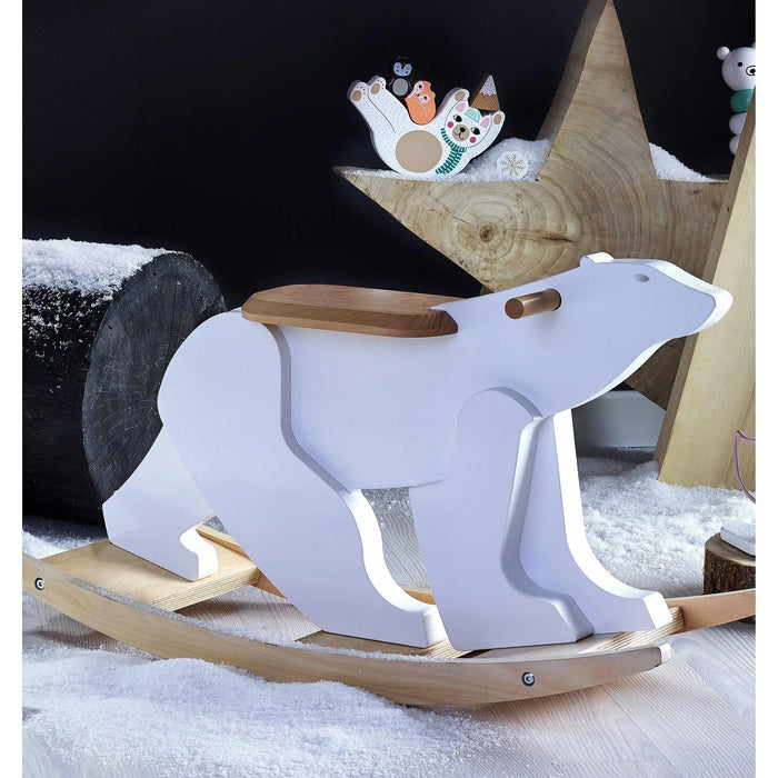 Wooden polar bear baby rocking toy with snow-themed decor and wooden star backdrop