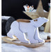 Wooden polar bear baby rocking toy with snow-themed decor and wooden star backdrop