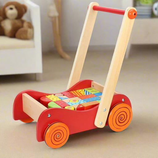 Wooden baby walker with colorful building blocks on carpet in cozy nursery room