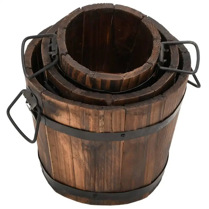 Set of three nested wooden bucket planters with metal handles and a burned wood finish
