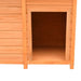 Wooden dog house kennel with open entrance and pine paneling for outdoor use