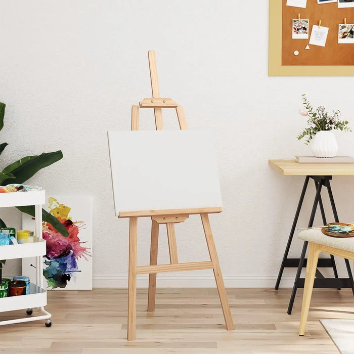 Natural pinewood easel with blank canvas in modern art studio setting