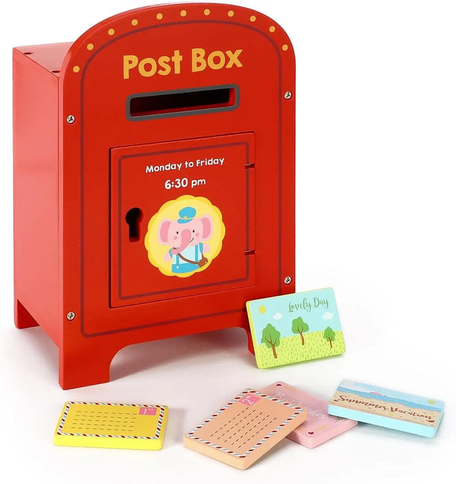 Red toy post box with a cartoon elephant and stationery items on a white background
