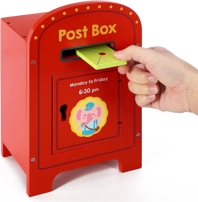 Red toy post box with a hand inserting a yellow card