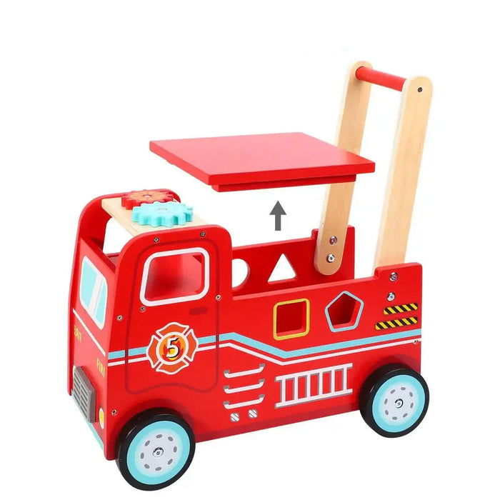 Red toy fire truck with a wooden push handle on a white background