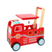 Red toy fire truck with a wooden push handle on a white background