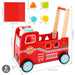 Red toy fire truck with wooden handle and shape sorting blocks, including measurements.