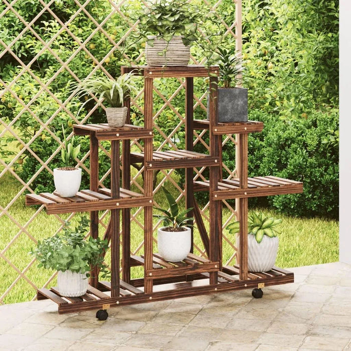 Wooden flower stand with wheels displaying potted plants on patio in garden setting.