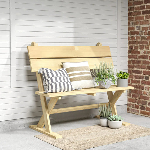 Natural wooden two-seater garden bench with slatted design, decorated with striped cushions and potted plants