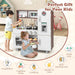 Children playing with wooden toddler kitchen playset featuring fridge, stove, and sink in bright room