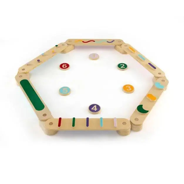 Wooden Montessori balance beam set with numbered stepping stones in a hexagonal layout