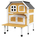 Two-tier yellow wooden outdoor cat house with terrace and jump platform