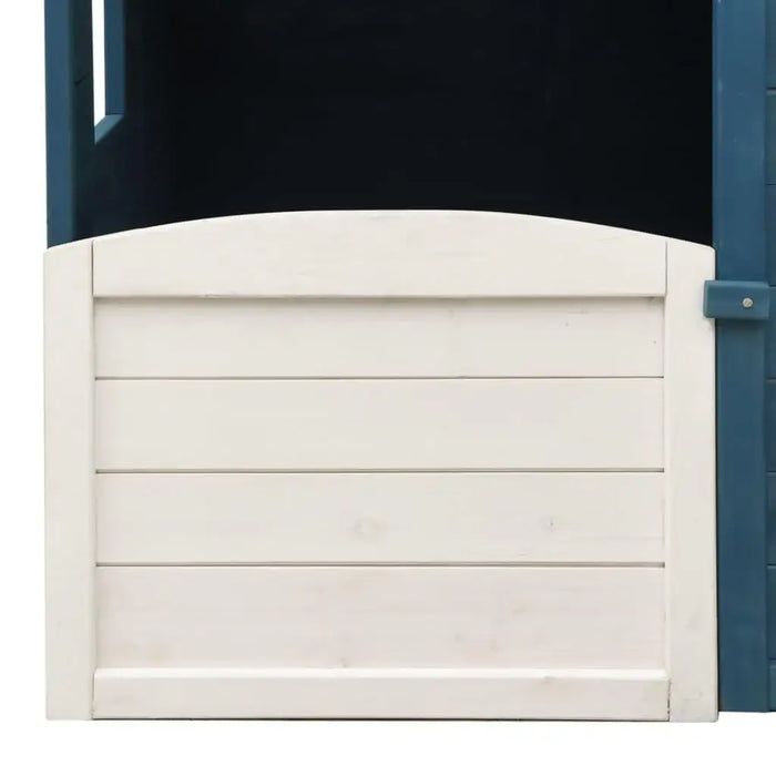White wooden gate attached to blue and grey outdoor playhouse panel